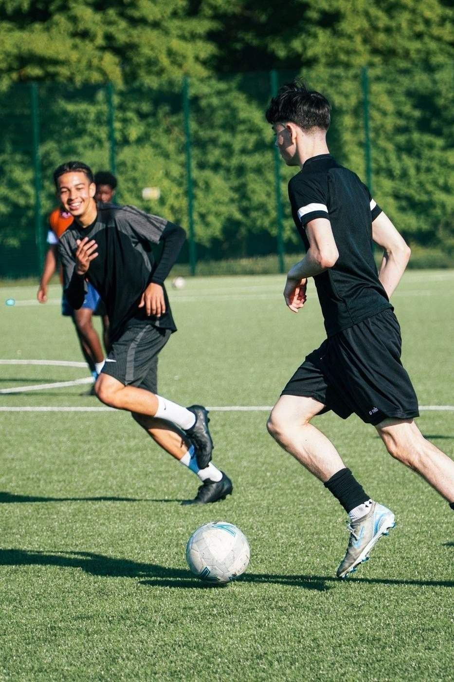 Players competing during an outdoor football session