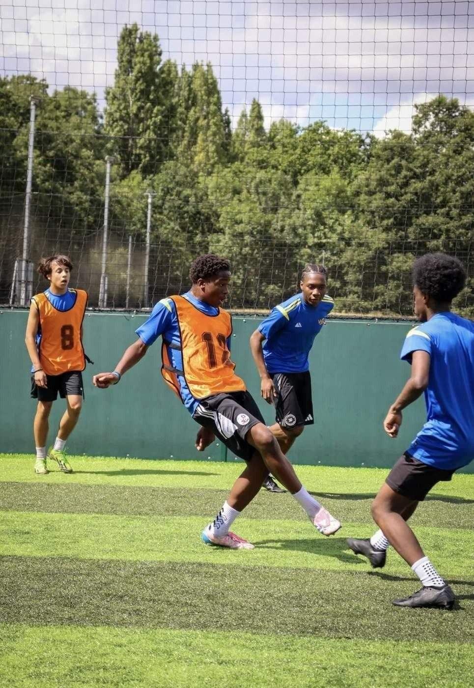 Players competing in a small-sided football practice