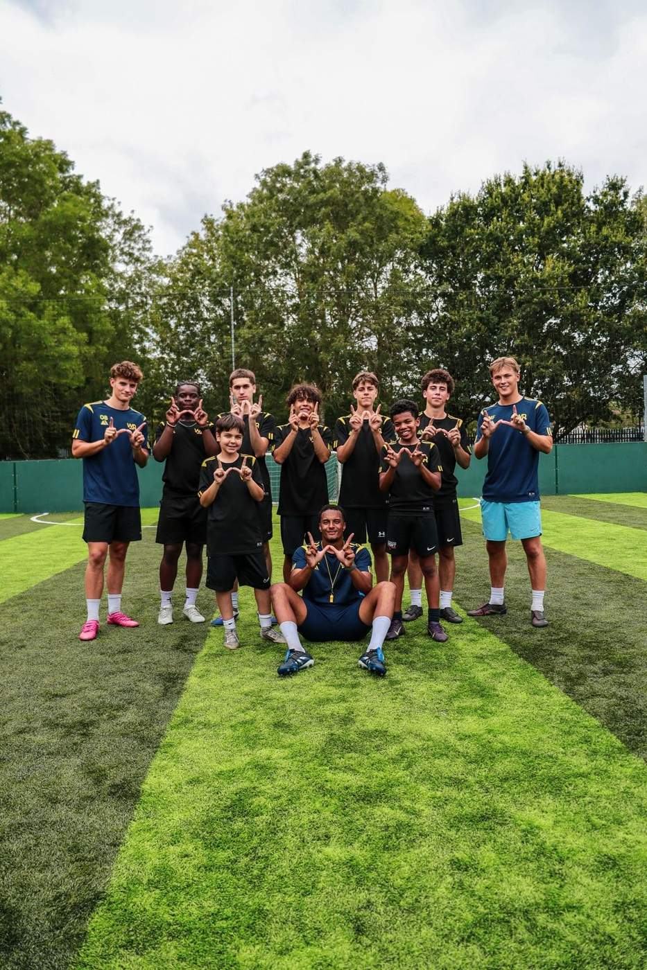 Summer Camp 2026 players and coach celebrating together