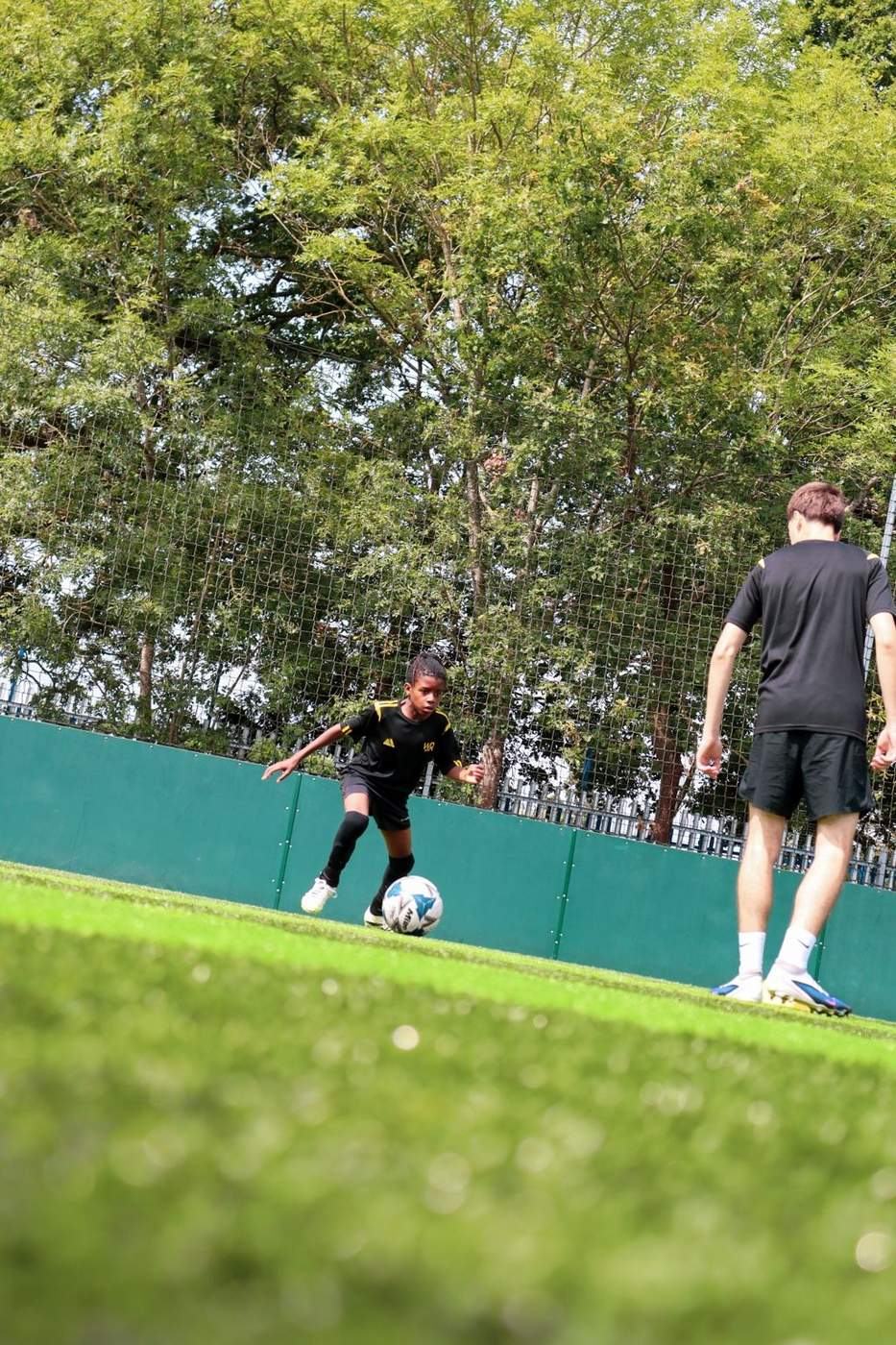 Young player working with the ball during coaching